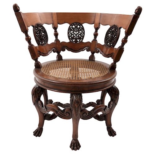 BURGERMEISTER CHAIR. DUTCH, CA. 1900. Lacquered and engraved wood with rattan seat.