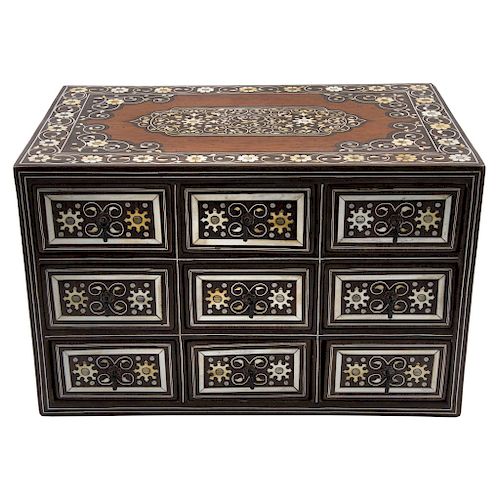 CHEST OF DRAWERS. SPAIN, 20TH CENTURY. Wood inlaid with mother of pearl and bone. Decorated with geometric motifs and rinceaux.