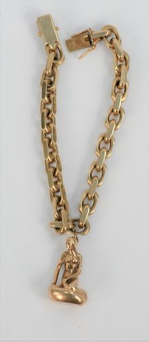 14 Karat Gold Heavy Link Bracelet, with heavy 14 karat gold charm of mermaid on rock mark Denmark. length 7 1/2 inches, 51.6 grams.