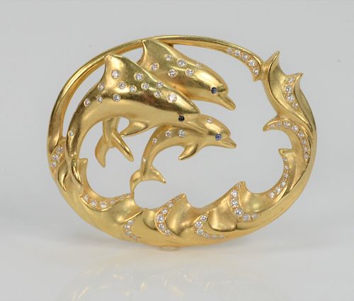 Julius Cohen 18 Karat Gold Pendant, with three jumping dolphins and waves set with diamonds. total height 2 1/4 inches, width 2 1/4 inches, 34.8 grams