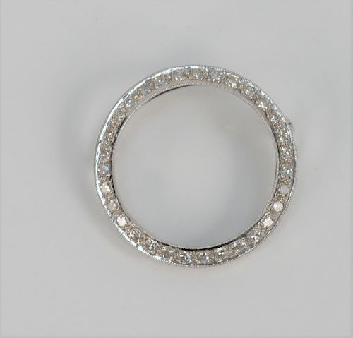 18 Karat White Gold and Diamond Circular Brooch, with half round pin. diameter 1 1/4 inches.