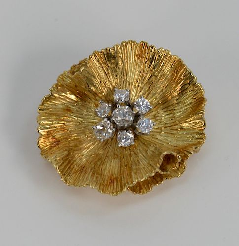 18 Karat Gold Flower Brooch Set, with seven diamonds. 1 1/4" x 1 3/8". 19.8 grams.