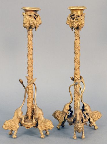 Pair of Gilt Bronze Lion Candlesticks, having goat mask over grapevine with three lion footed base. height 12 3/4 inches.
