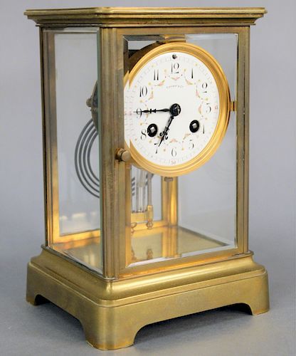 Tiffany and Company French Mantle Clock, having brass frame with beveled glass case, hinged doors and white enameled dial with painted floral garland,