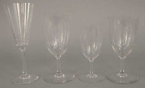A Baccarat Etched-Glass Part Drinkware Service, etched with butterflies and flowers, comprising of thirteen sherry glasses and seventeen white wine gl