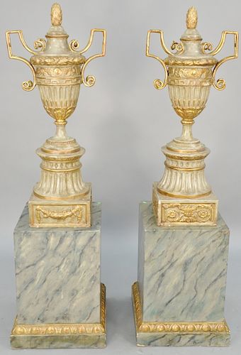 Pair of Monumental Continental Faux Marble Urns, classic form having pineapple finial with metal mounted handles on square bases on faux marble painte