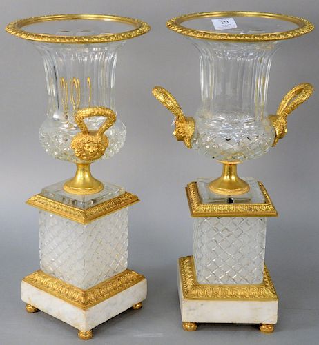 Pair of French Bronze Dore and Crystal Urns, having flared top with bronze mounted rim, gilt bronze mask handles on bronze socle, resting on bronze mo