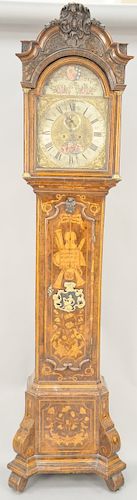 Dutch Tall Clock, having carved and marquetry inlaid case with instruments and birds set on plain feet, having brass dial with moon phases with second