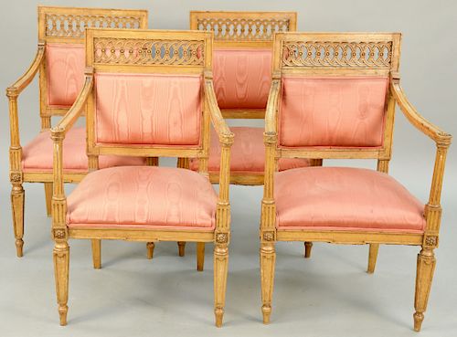 Set of Four Italian Neoclassical Armchairs, having square carved back rail over upholstered back, tapered stop fluted arms with rosette terminals, all