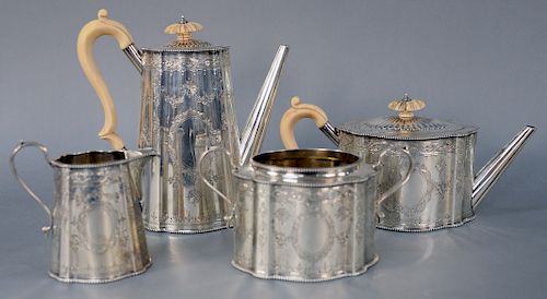 Four Piece English/Irish Tea Set, with coffee pot, teapot, sugar and creamer, having overall chased decoration, marked Sharma D. Neill Belfast (no cov