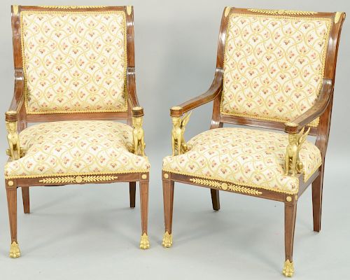 Pair French Egyptian Revival Ormolu Mahogany Mounted Open Armchairs, with sphynx form arm supports and paw sabots, late 19th century. height 41 inches