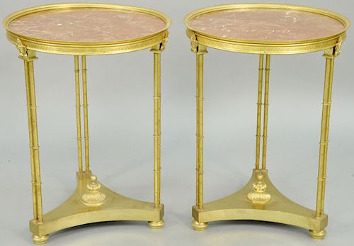 Pair of Neoclassical Style Dore Bronze Gueridons, with marble tops. height 27 inches. diameter 20 1/2 inches.