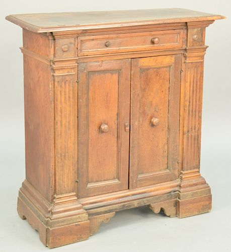 Continental Provincial Small Cabinet, one drawer over two doors oak secondary (cupping to top, splits and separations throughout with some losses). he