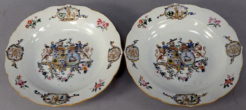 Pair of Chinese Export Plates, armorall center having two crests flanked by lions on each side.
