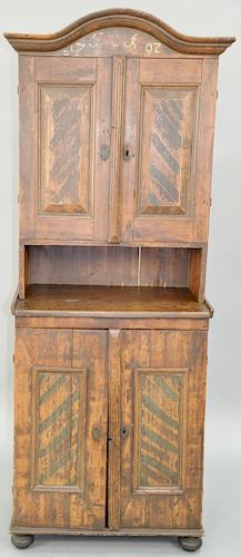 Continental Cabinet in Two Parts, upper section with two doors opening to reveal three drawers set on lower section having two doors with two fitted d