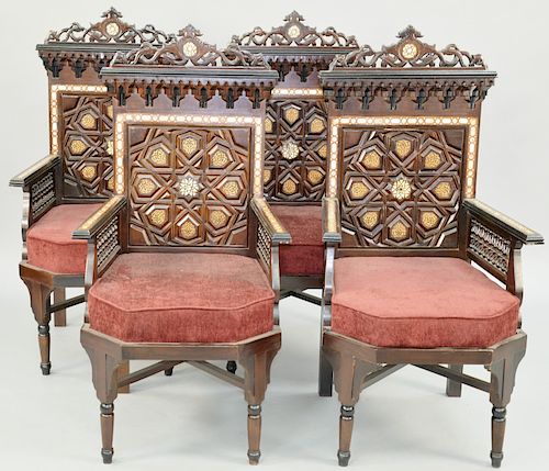 Set of Four Moorish Aesthetic Movement Armchairs, mother of pearl inlaid, with high claret colored velvet slip seats, late 19th century. height 49 inc