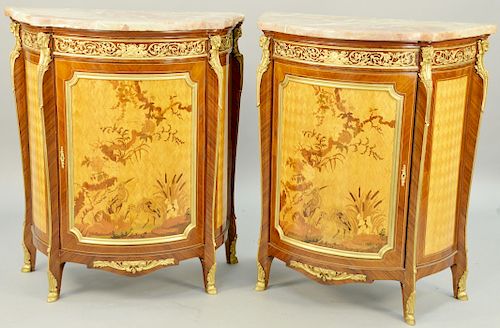Pair of Louis XV Style Inlaid Cabinets, ormolu mounts with ram heads and putti figures in demilune form with parquetry panels and doors having marquet