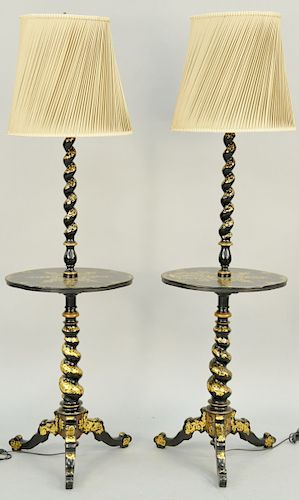 A Pair of Victorian Black and Gilt Japanned and Mother of Pearl Inset Lamp Tables, 19th century, spiral twist support and oval top decorated with arab