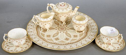 Eight Piece Belleek Pink Lace Tea Set, consisting of large tray, teapot, creamer, sugar, two cups and two saucers, pink with gold accents, all having 