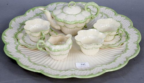 Eight Piece Belleek Tea Service Set, consisting of large tray, tea pot, creamer, three cups, and two saucers all having black Belleek mark. tray diame