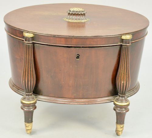 English Regency Parcel Gilt Mahogany Oval Cellarette, hinged lid, green painted metal, 19th century. total height 23 inches, top: 20" X 27".