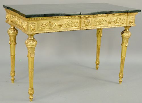 Italian Neoclassical Giltwood Console, having green rectangular marble top with outset corners, above carved gilt frieze with foliate scrolls centerin