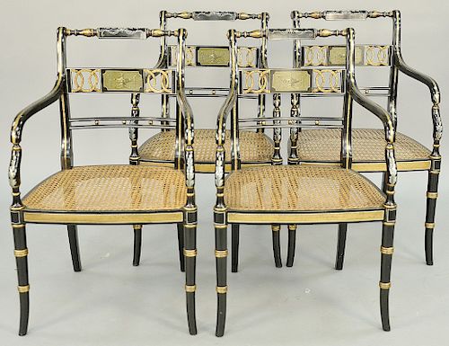Set of Four Regency Style Open Armchairs, having gilt decoration and black and gold paint decorated cane seats. height 33 inches. Provenance: Estate o