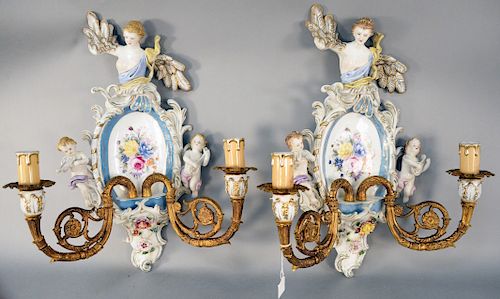 Pair of German Porcelain and Bronze Two Light Sconces, having large angel figure above floral painted back plate with cherubs on each side, two gilt b