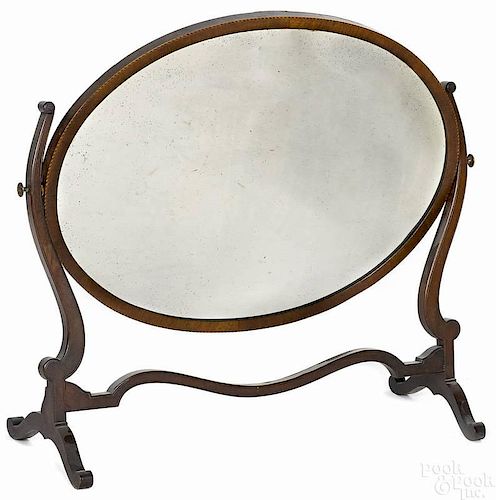 Mahogany swivel action dressing mirror, 19th c.,