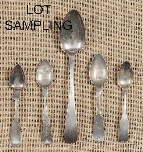 Sixteen coin silver spoons, to include examples b