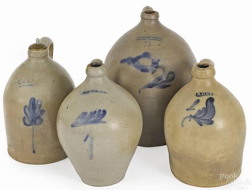Four stoneware jugs, 19th c., with cobalt decorat