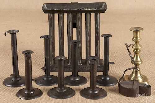 Seven tin hogscraper candlesticks, 19th c., toget