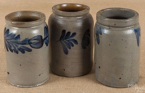 Three stoneware jars, 19th c., with cobalt floral