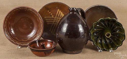 Seven pieces of redware, 19th/20th c., to include