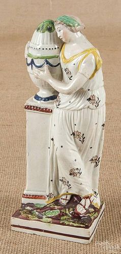 Pearlware figure of a woman, ca. 1800, flanking a