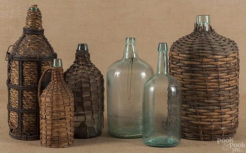 Four Demijohn bottles, 19th c., together with two