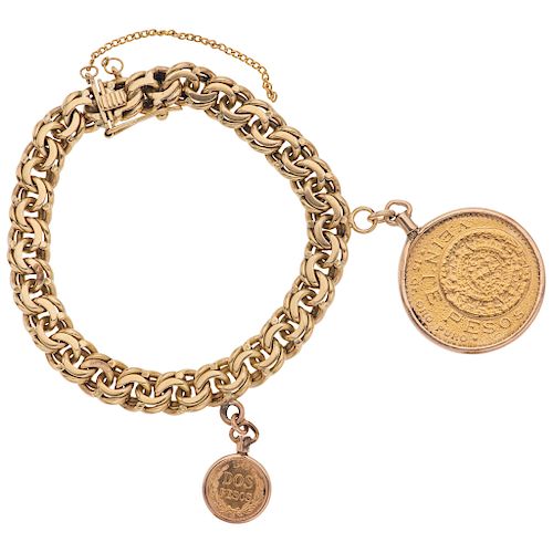 WRISTBAND AND PENDANT WITH DEMONETIZED COIN. 21.6K, 14K AND 10K YELLOW GOLD