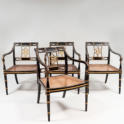 Set of Four Regency Ebonized, Parcel-Gilt and Caned Armchairs