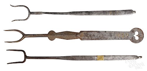 Three wrought iron flesh forks