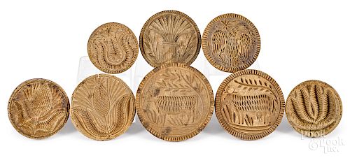 Eight carved butterprints
