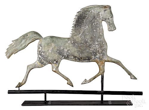 Swell bodied copper trotting horse weathervane