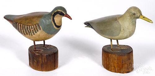Two carved and painted birds