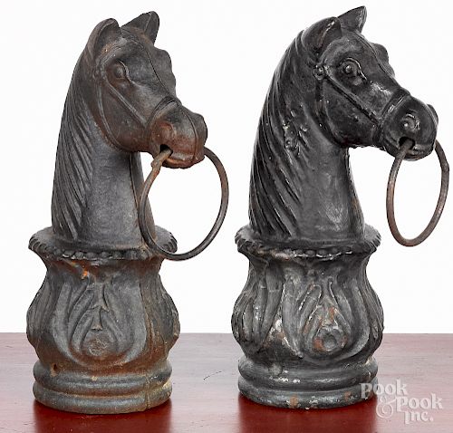 Pair of cast iron horsehead hitching post finials