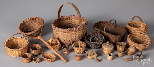 Collection of small woven baskets.