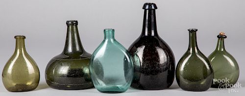 Six blown glass bottles