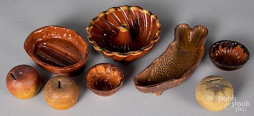 Five redware molds, together with three banks
