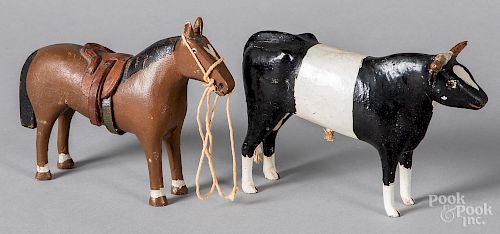 Carved and painted cow and horse