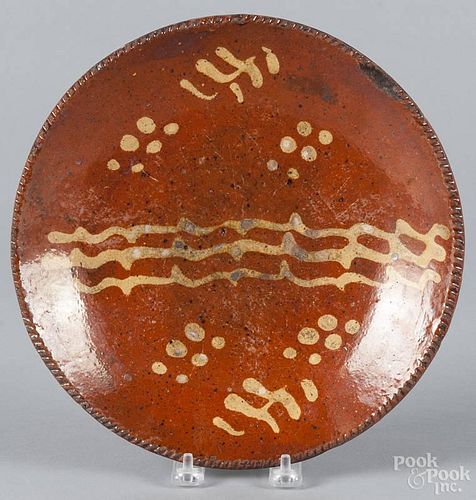 Pennsylvania redware plate, 19th c., with yellow slip decoration, 10 1/4'' dia.