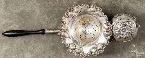 Sterling silver tea strainer with strawberry repoussé border, inscribed Non-Exertion Club