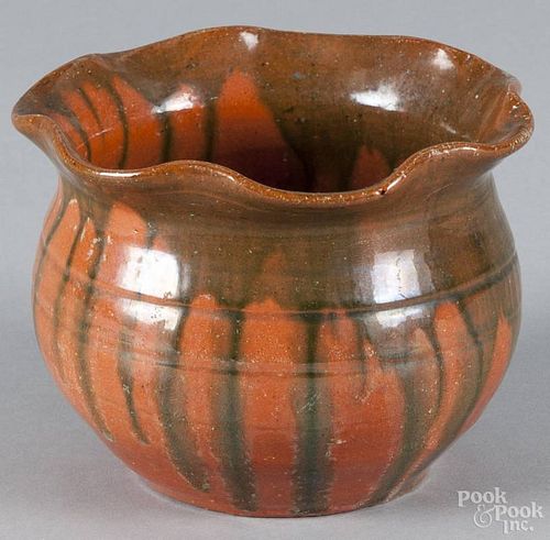 North Carolina redware flowerpot, 20th c., with green drip glaze, 4'' h.